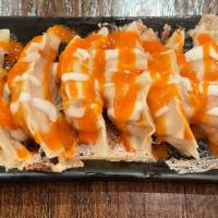 Buffalo Chicken Dumpling · Six pieces. Chicken breast seasoned with buffalo sauce. Served with blue cheese, chives, and...
