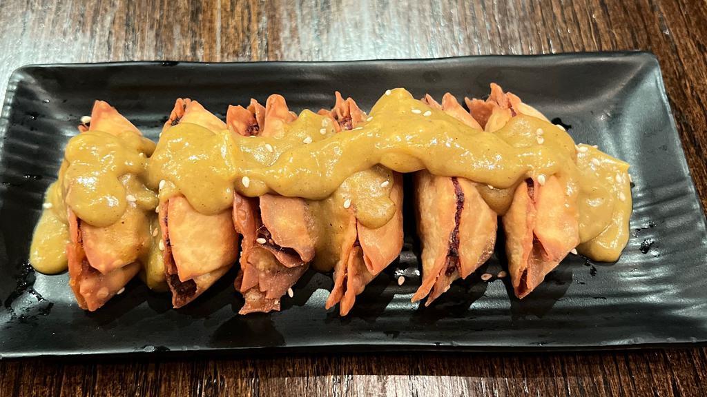 Curry Chicken Dumpling · Six pieces. Chicken sautéed, topped with delicious house made curry sauce.