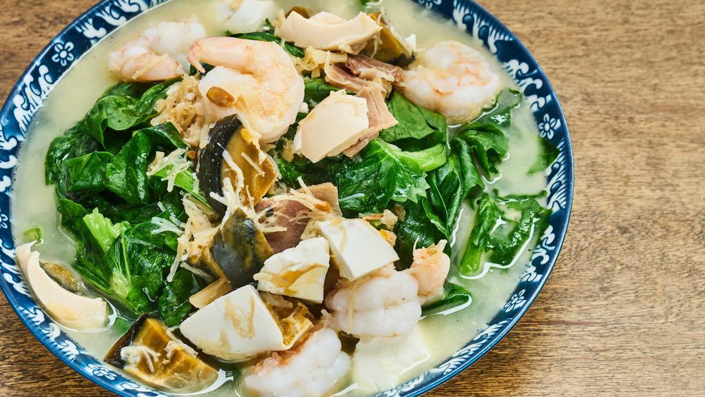 Snow Pea Shoot In Rich Broth · Gluten-free. Snow pea shoot, salted egg, century egg, ham, shrimp, Scallop, chicken broth. Can be stir-fried.