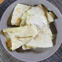Quesadilla De Maiz · Corn tortilla quesadilla. With mozzarella cheese, lettuce, sour cream and cotija cheese.