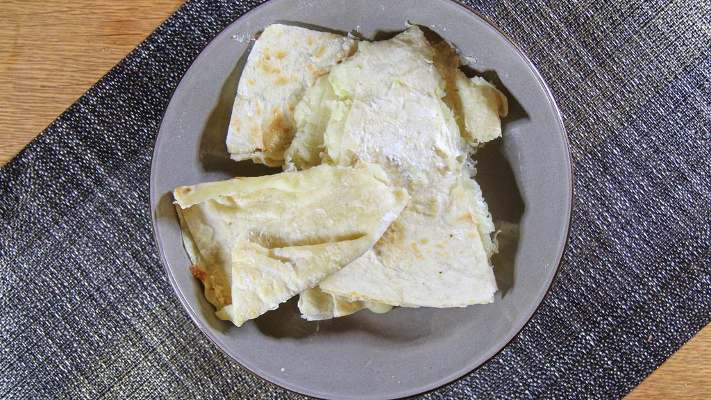 Quesadilla De Maiz · Corn tortilla quesadilla. With mozzarella cheese, lettuce, sour cream and cotija cheese.