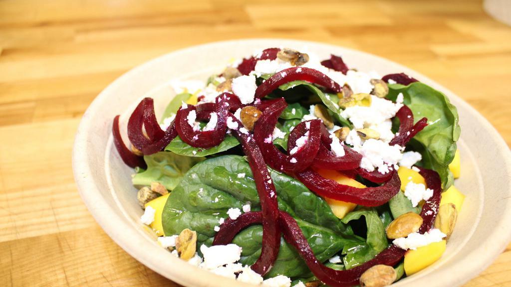 Spinaci · Baby spinach, mango, pistachios, golden beets, goat cheese and balsamic vinaigrette.