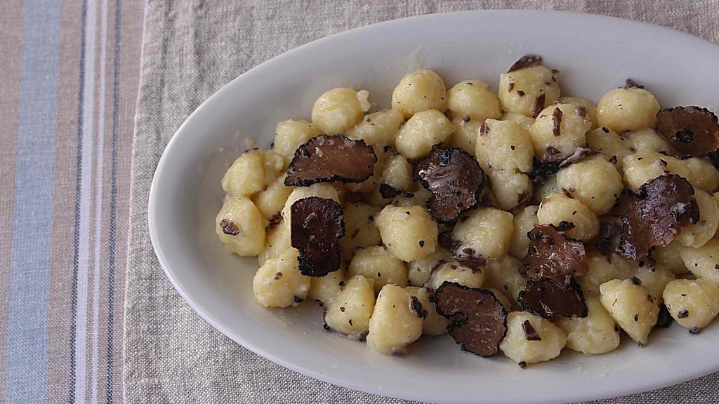 Black Truffle · Porcini mushrooms and potatoes gnocchi, black truffle sauce, shaved black truffle.