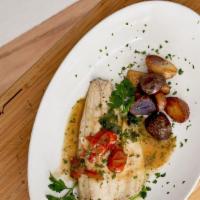 Mediterranean Branzino · Served with roasted potatoes.