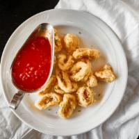 Calamari Fritti · Lightly battered and fried to a tender, crispy golden brown served with a tangy marinara sau...