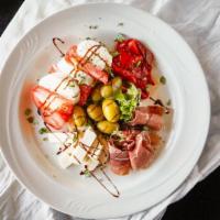 Antipasto Italiano · Prosciutto, fresh mozzarella, tomatoes and roasted peppers.