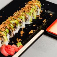 Tiger Roll · Tempura salmon, spicy kani, portobello, and crunch. Topped with avocado and fried onion.