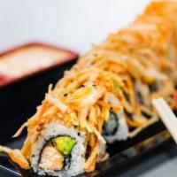 Mt Fuji Roll · Tempura and salmon, avocado, topped with spicy kani.