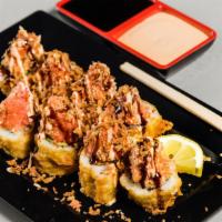 Thunder Roll · Cooked salmon, sweet potato, and avocado. Topped with spicy tuna and a sprinkle of fried oni...