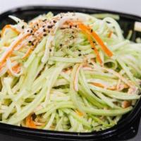 Kani Salad · Shredded kani mixed with thinly shredded cucumber tossed in a light mayo-based dressing.