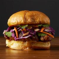 The Spicy Satay · A tender, juicy chicken sandwich topped with crunchy red cabbage, fresh carrots, chopped cil...