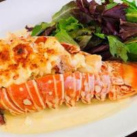 Langosta Lamborghini · Lobster tail stuffed with seafood and topped with grated Parmesan Cheese after been flamed w...