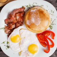 3 Piece Pancake With Eggs And Meat · Hot delicate pancakes served with your choice of egg preparation, meat preparation, creamy b...