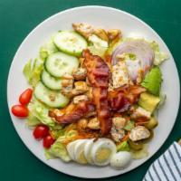 Cobb Salad · Mixed greens, tomatoes, onions, cucumbers, green olives, carrots, hard boiled egg, grilled c...