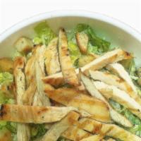 Caeser Salad · Grilled breast of chicken over romaine lettuce and croutons, dressed with caesar dressing & ...