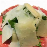 Carpaccio Di Manzo · Veneto. Grass-fed thin-sliced beef, baby arugula, aged asiago cheese.