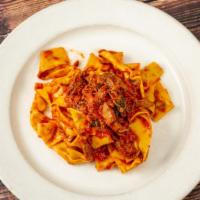 Pappardelle Al Ragu Di Carne · Umbria. Wide ribbon pasta in short rib ragu.