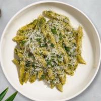 Pesto Penne Penance · Fresh penne pasta cooked in pesto sauce topped with black pepper, parsley, and mozzarella.