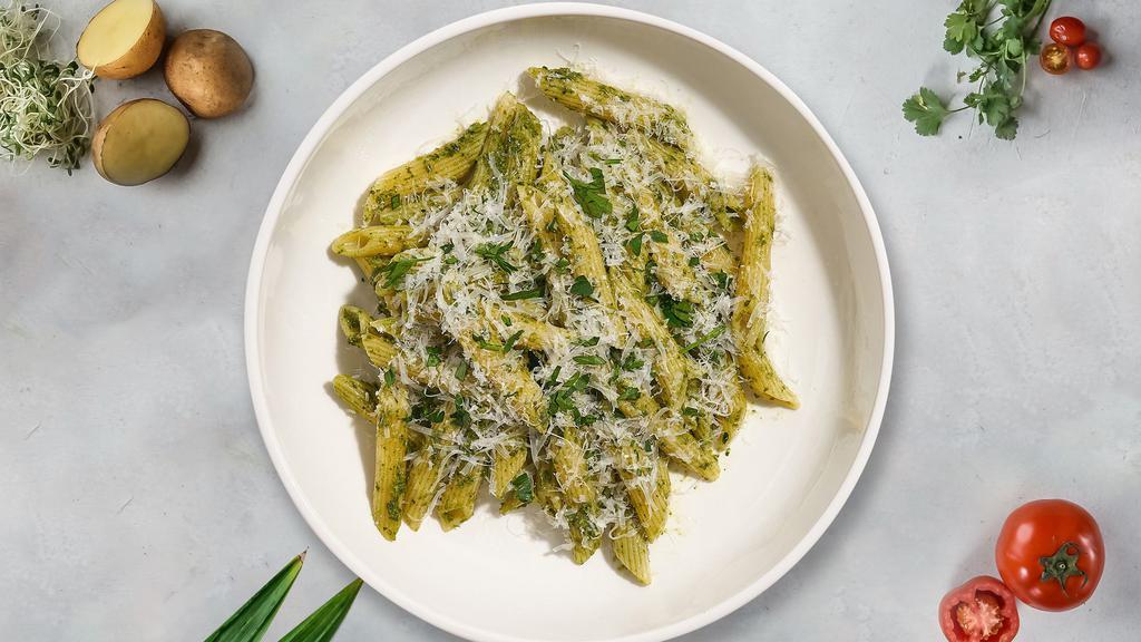 Pesto Penne Penance · Fresh penne pasta cooked in pesto sauce topped with black pepper, parsley, and mozzarella.