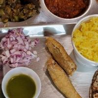 Gujarati Thali · Three vegetables, one farsan, one sweet, daal, rice, papad, pickle, chaas and roti.