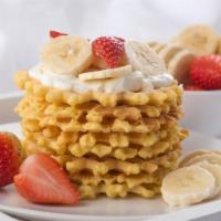 Strawberry Banana Waffle · Fresh yummy waffle with sweet strawberries and bananas on top.