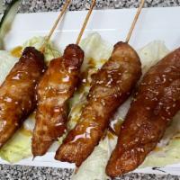 Yakitori · 4 pieces, White meat chicken skewered with scallions covered in a sweet teriyaki sauce and s...