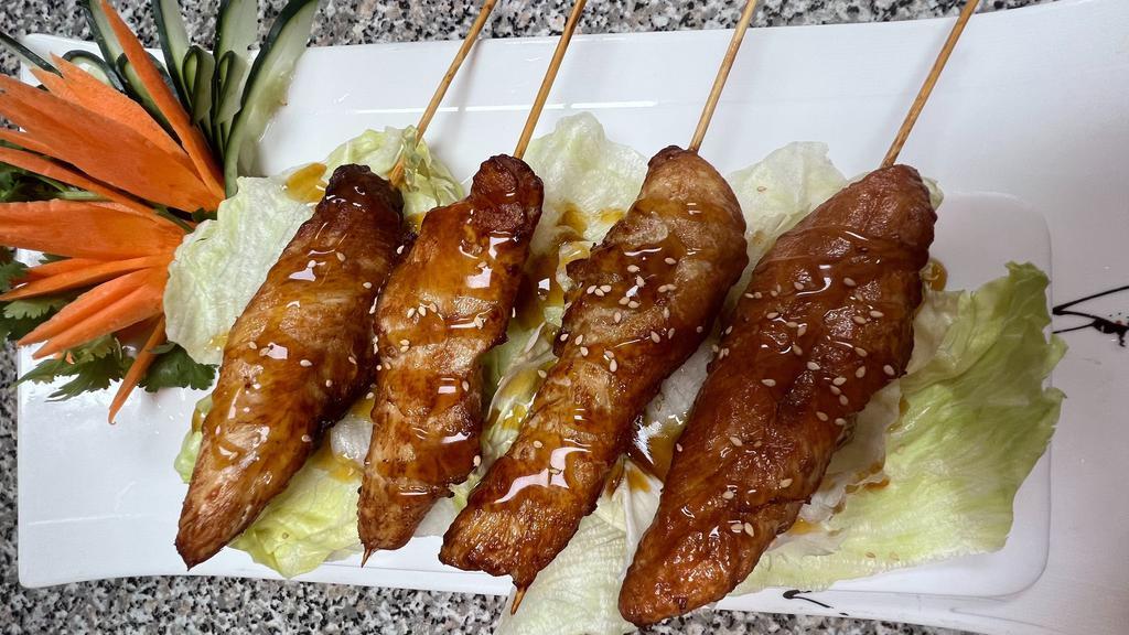 Yakitori · 4 pieces, White meat chicken skewered with scallions covered in a sweet teriyaki sauce and sesame seeds