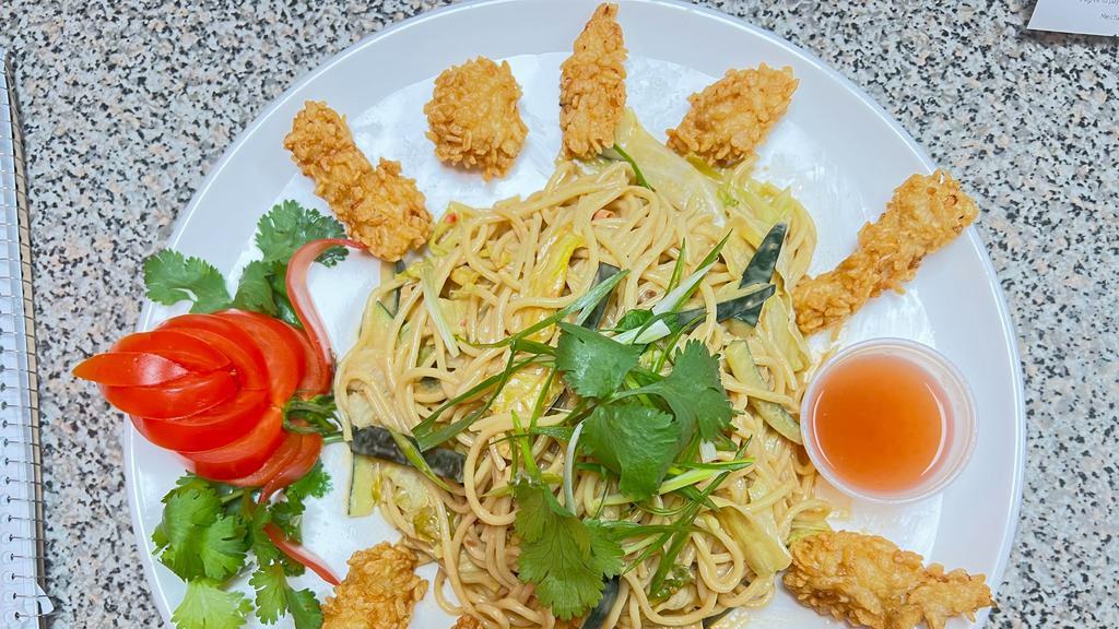 Crispy Chicken Noodle · wheat noodles, crispy chicken, cucumbers, lettuces, cilantro, sesame seeds and scallions, tossed with creamy peanuts butter dressing