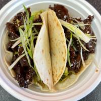 Boxo'S Tacos · Soft mini flour tortilla wraps with lettuce, cilantro, sesame seeds tossed in house special ...