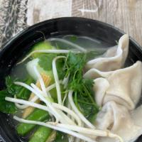 Dumpling Noodle Bowl · Thin egg noodles, steamed pork dumpling, veggies, and scallions in our house made chicken br...