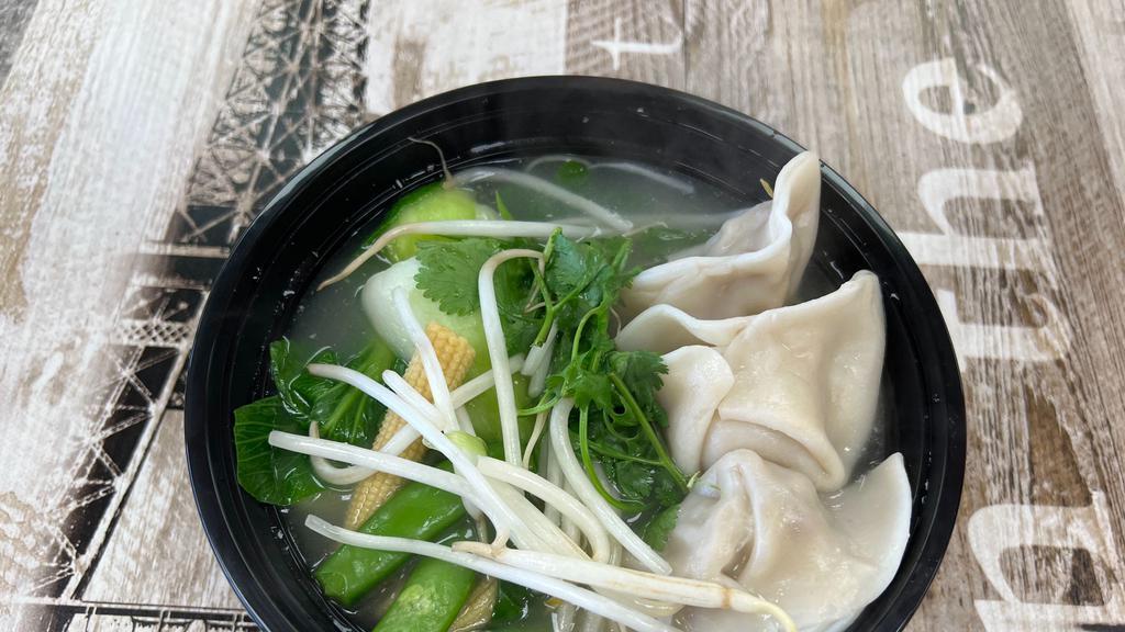 Dumpling Noodle Bowl · Thin egg noodles, steamed pork dumpling, veggies, and scallions in our house made chicken broth
