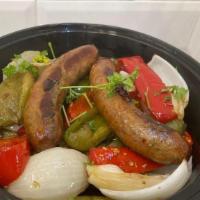 Sausage, Peppers & Onions · Sausage, green and red peppers, and white onions served hot topped with marinara, garnished ...