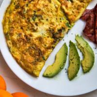 Two Eggs, Cheese, Avocado And Meat · Delicious breakfast sandwich made with two eggs, cheese, avocado and choice of meat, served ...