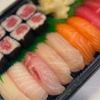 Sushi Deluxe · Nine Piece sushi and tuna roll.miso soup and salad