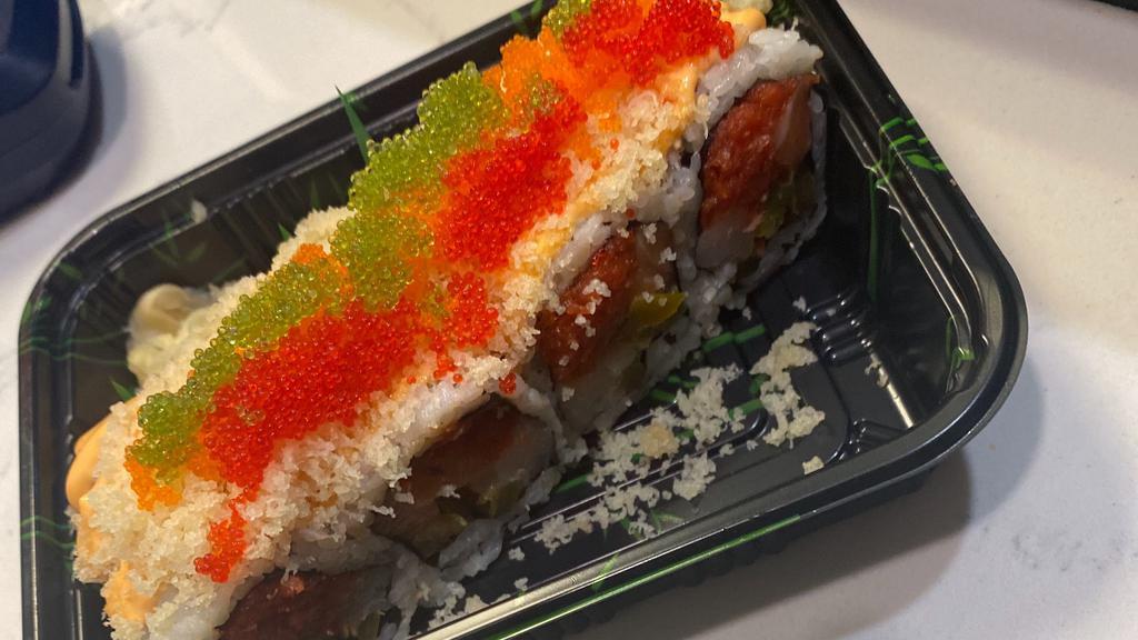 Volcano Roll · In: spicy tuna, salmon, yellowtail and jalapeño out: spicy mayo,crunch and tobiko.