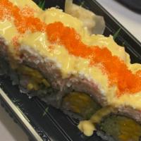 Crystal Mango Roll · In: shrimp, mango and cucumber out: crab-meat mayo with mango sauce and masago.