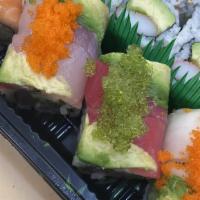 Rainbow Roll · In: crab stick and cucumber out: tuna salmon white fish. avocado and tobiko.