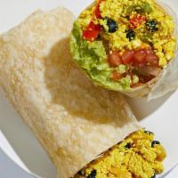 Vegan Mexican Breakfast Burrito · Scrambled tofu with sauteed peppers and onions, black beans, pico de gallo, and avocado in a...
