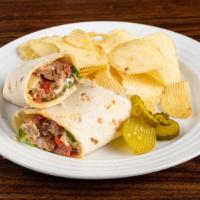 Steak Wrap · Fresh seared steak sautéed peppers and onions served over lettuce, tomatoes finished with ho...