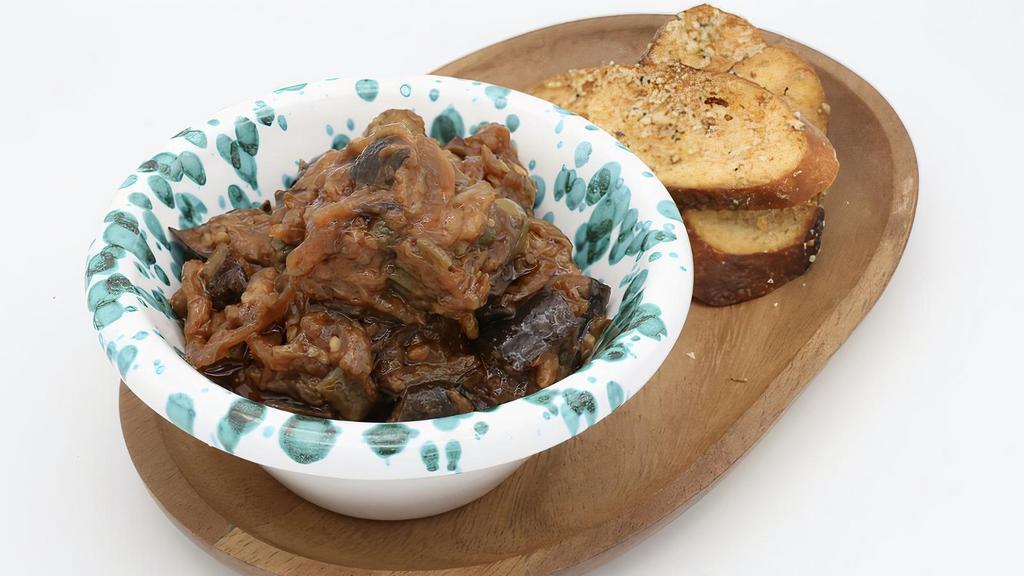 Caponata · Eggplant, celery, green olives, capers, onions and tomato in sweet and savor, crostini bread