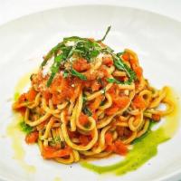 Trenette Al Pomodoro · Home made spaghetti with fresh tomato, garlic, basil, parmigiano cheese