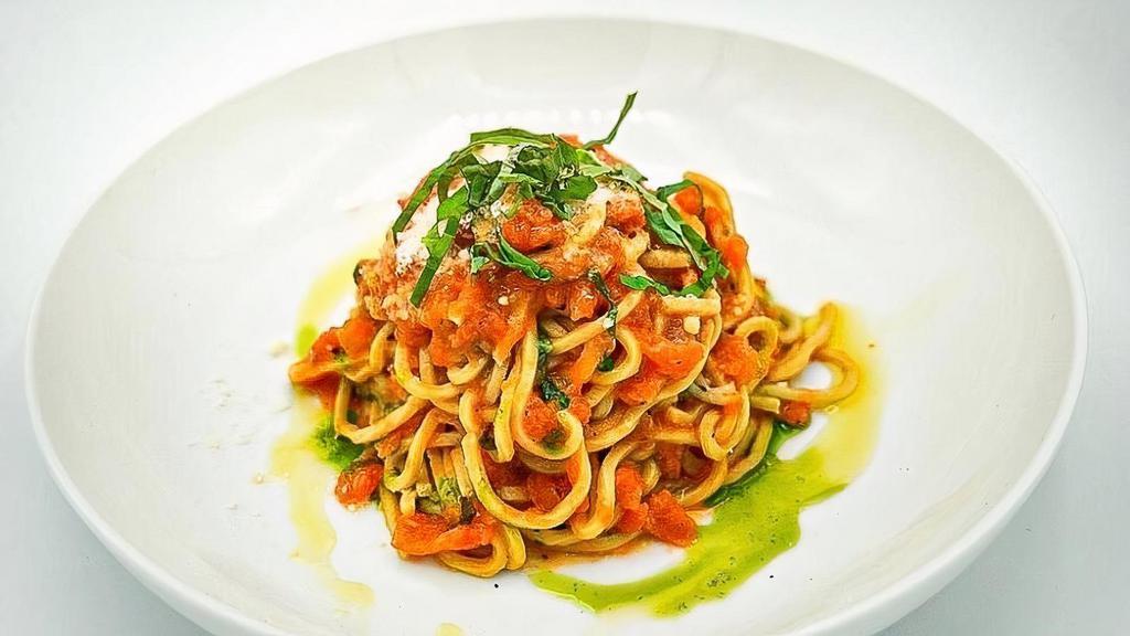Trenette Al Pomodoro · Home made spaghetti with fresh tomato, garlic, basil, parmigiano cheese