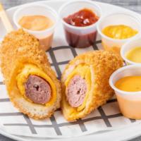 Cheddar Cheese Hot Dog / 체다치즈 핫도그 · All beef. A hot dog with sausage wrapped in creamy Cheddar cheese. / 짭짤하고 고소한 체다치즈가 소시지를 감쌌다!