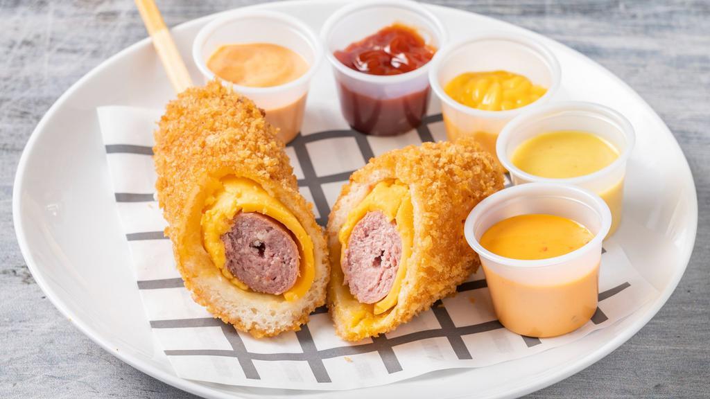 Cheddar Cheese Hot Dog / 체다치즈 핫도그 · All beef. A hot dog with sausage wrapped in creamy Cheddar cheese. / 짭짤하고 고소한 체다치즈가 소시지를 감쌌다!