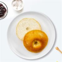 Buttery Bagel · Toasted bagel topped with butter.