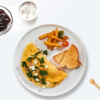 Famous Greek Omelette · Eggs cooked with feta cheese, onions, and tomatoes as an omelette. Served with a side of hom...