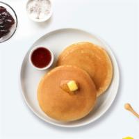 Three Buttermilk Pancakes · (Three pieces) Fluffy pancakes cooked with care and love served with butter and maple syrup.