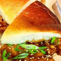 General Tso'S Crispy Chicken Sandwich · smothered in house-made general tso's sauce & topped with scallions & sesame seeds on our ho...