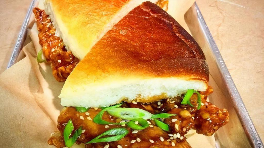 General Tso'S Crispy Chicken Sandwich · smothered in house-made general tso's sauce & topped with scallions & sesame seeds on our house roll.