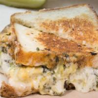 Spinach & Artichoke Grilled Cheese · our spinach & artichoke dip melted onto two slices of toasted white bread. Vegetarian.